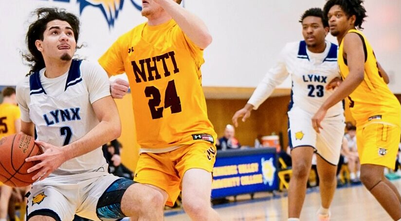 Men's Basketball hold off NHTI during game.
